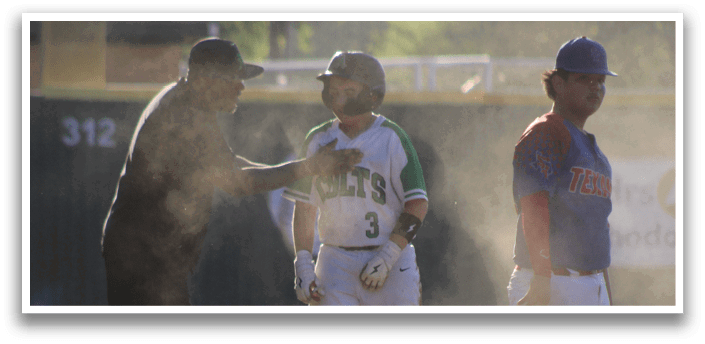 A baseball game is taking place with three players on the field. One player is wearing a green jersey and another is wearing a blue jersey. The third player is wearing a black shirt. The players are standing on the field, and one of them is holding a baseball bat. AI generated content