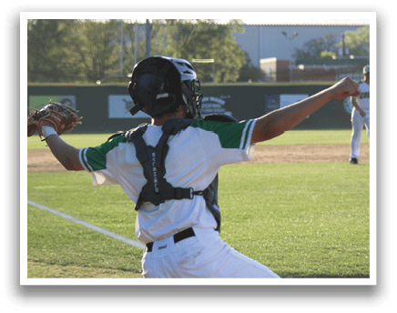 A baseball player in a white uniform is squatting on the field, wearing a catcher's mitt and a helmet. AI generated content