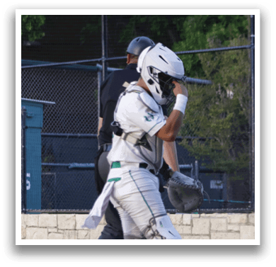 A baseball player is up to bat, ready to swing. Description generated by AI