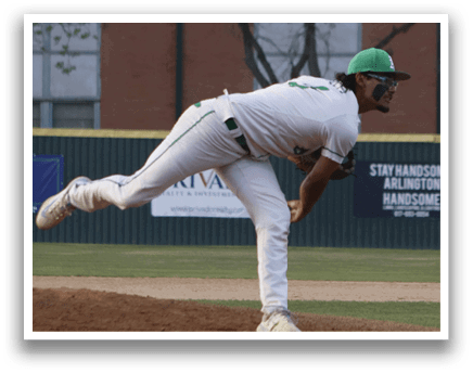 A baseball player in a white uniform is pitching a ball. Description generated by AI