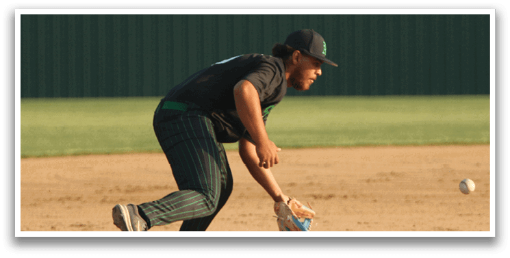 A baseball player catching a ball. Description generated by AI