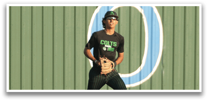A baseball player wearing a black shirt and red shoes. Description generated by AI