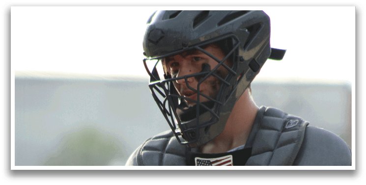 A baseball player wearing a helmet and catcher's mitt. Description generated by AI