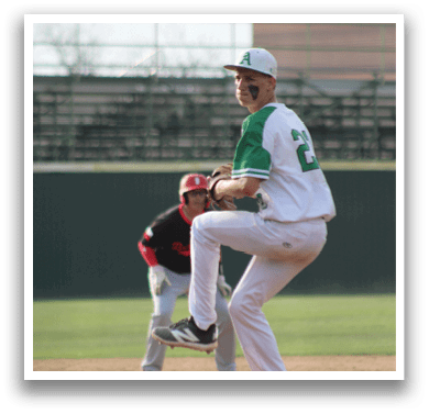 A baseball player in a white uniform is pitching a ball. Description generated by AI