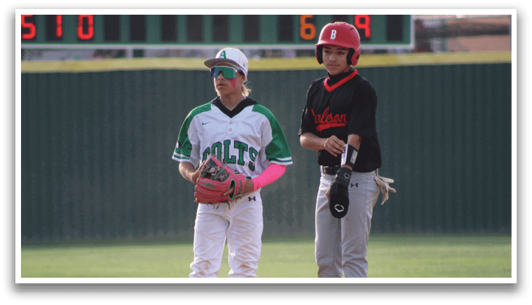 Two young boys playing baseball. Description generated by AI