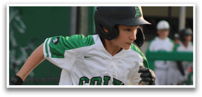 A boy wearing a baseball uniform with the word Colt on the front. Description generated by AI