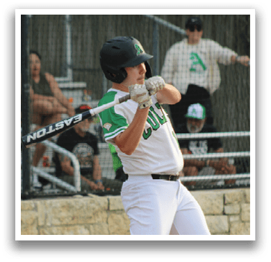 A baseball player in a white uniform is swinging a bat. Description generated by AI