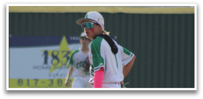 A baseball player wearing a green and white uniform with a red glove. Description generated by AI
