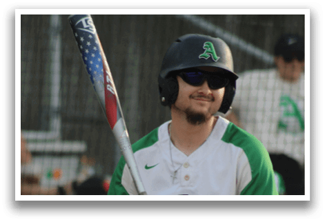 A baseball player wearing a helmet and holding a bat. Description generated by AI