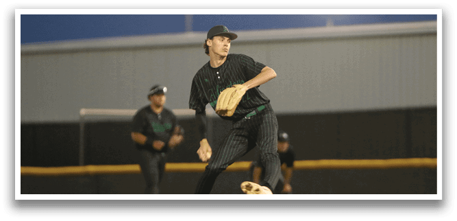 A baseball player in a black shirt and green hat is pitching a ball. Description generated by AI