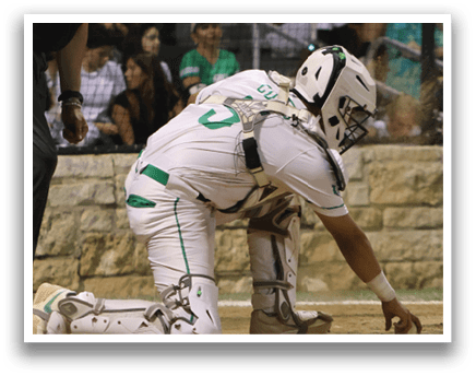 A baseball player kneeling on the ground. Description generated by AI