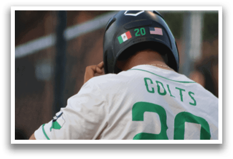 A man wearing a white shirt with the number 20 on it. Description generated by AI