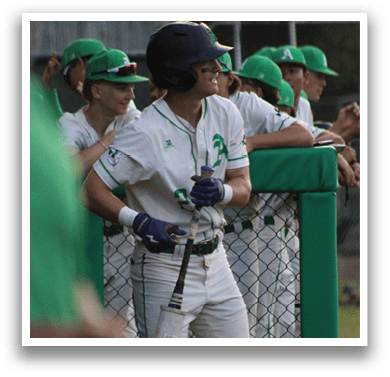 A baseball player wearing a green hat and white uniform is throwing a baseball. Description generated by AI