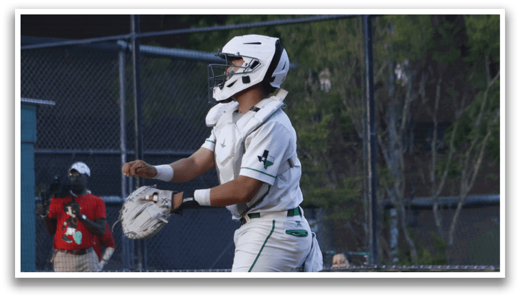 A baseball player catching a ball. Description generated by AI