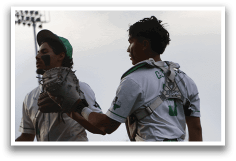 A group of baseball players on a field. Description generated by AI