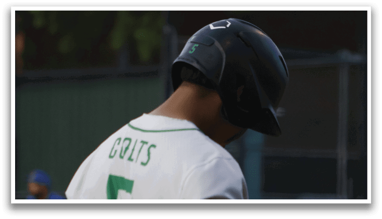 A baseball player wearing a green and white uniform. Description generated by AI