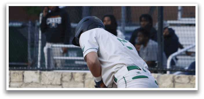 A baseball player in a white uniform is catching a ball. Description generated by AI