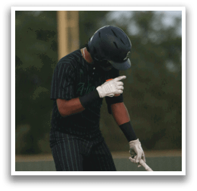 A baseball player holding a bat. Description generated by AI