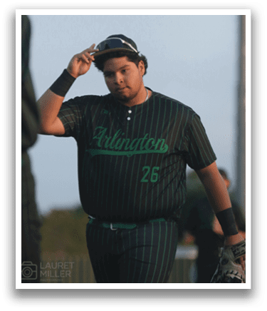 A man wearing a black and green baseball jersey. Description generated by AI