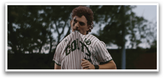 A baseball player is running on the field. Description generated by AI