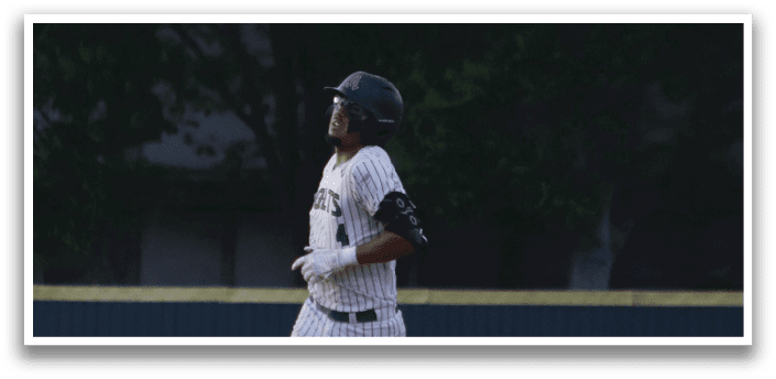 A baseball player running on the field. Description generated by AI