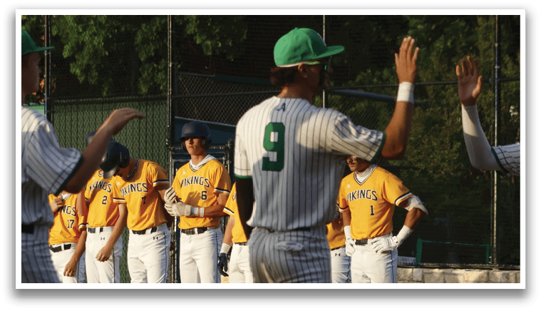 A baseball player wearing a green hat and a yellow shirt. Description generated by AI