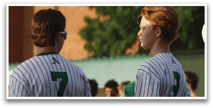 A group of baseball players standing on a field. Description generated by AI