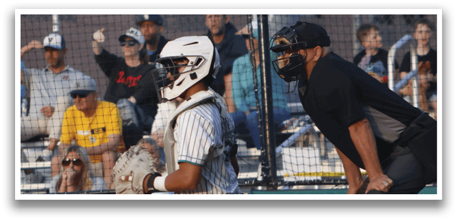 A baseball player is swinging a bat at a ball. Description generated by AI