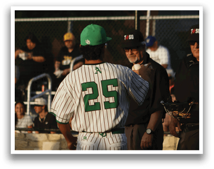 A baseball player wearing a green and white uniform with the number 25 on the back. Description generated by AI
