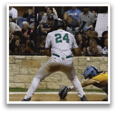 A baseball player sliding into home base. Description generated by AI