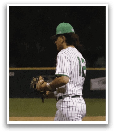 A baseball player wearing a green hat and a white and green striped uniform. Description generated by AI