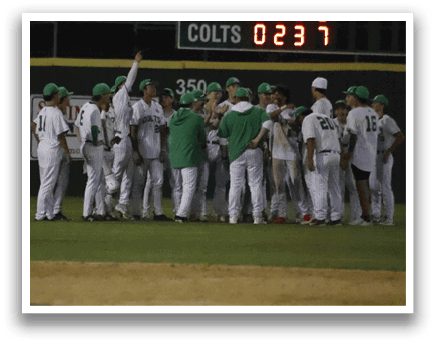 A group of baseball players wearing green and white uniforms. Description generated by AI