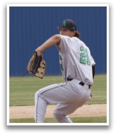 A baseball player in a white uniform is pitching a ball. Description generated by AI