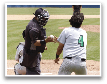 A baseball player is at bat, ready to swing. Description generated by AI