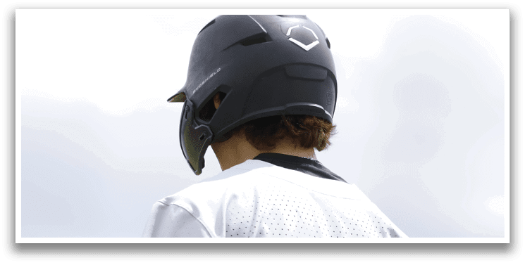 A baseball player wearing a green and white jersey. Description generated by AI