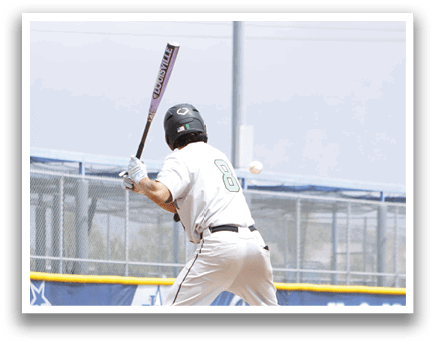 A baseball player in a white uniform is swinging a bat. Description generated by AI