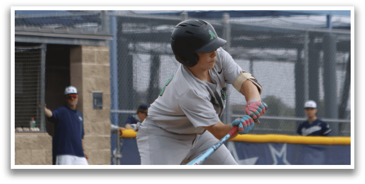 A baseball player in a grey uniform is swinging a bat. Description generated by AI