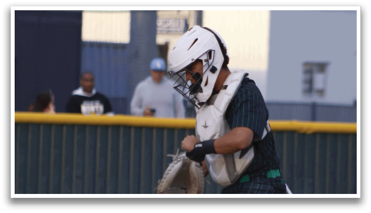A person wearing a baseball uniform and holding a mitt. Description generated by AI