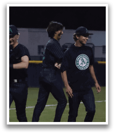 A group of people standing on a field. Description generated by AI