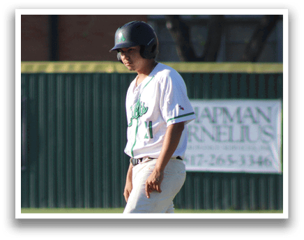 A baseball player wearing a white and green jersey. Description generated by AI
