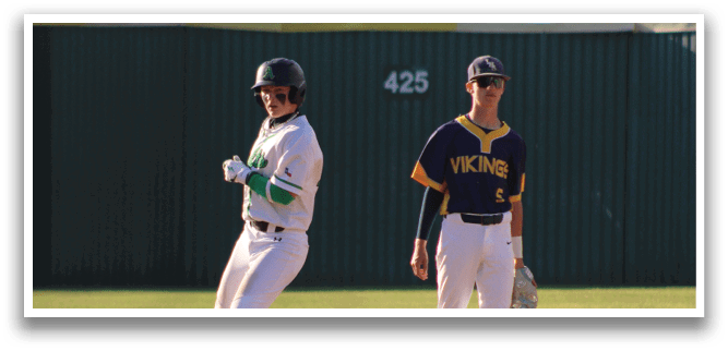 A baseball player in a white uniform is running to a base. Description generated by AI