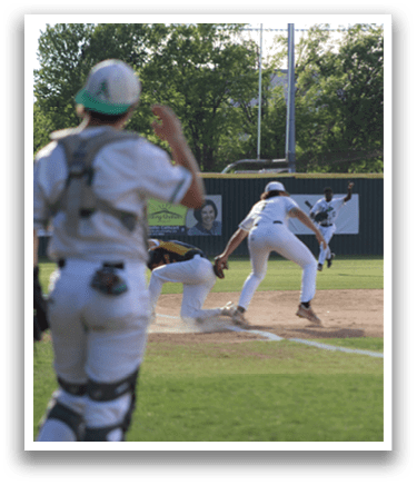 A baseball player sliding into a base. Description generated by AI