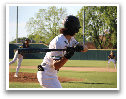 A baseball player in a white uniform is swinging a bat. Description generated by AI