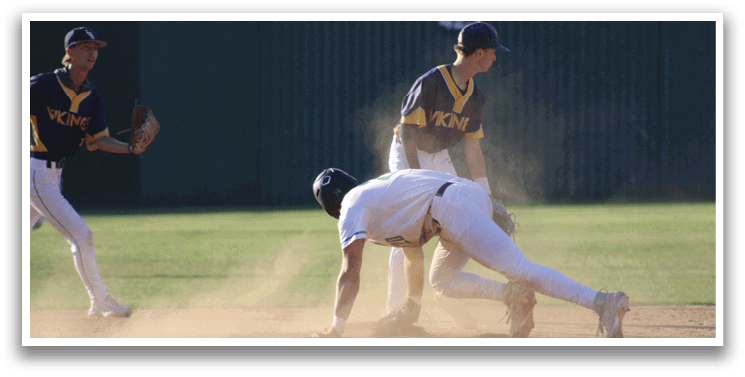 A baseball player sliding into a base. Description generated by AI