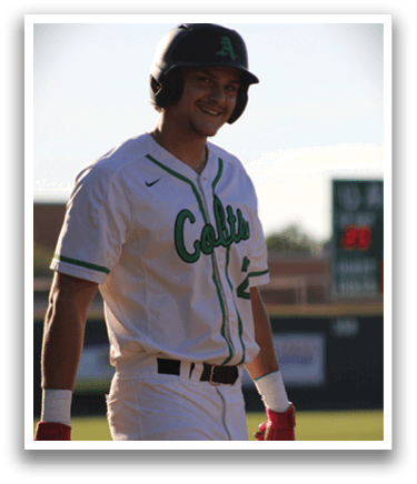 A baseball player wearing a white jersey with the word Cats on it. Description generated by AI