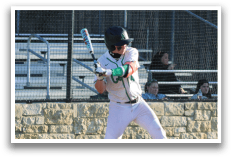 A baseball player in a white uniform is swinging a bat. Description generated by AI