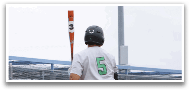 A baseball player is swinging a bat. Description generated by AI