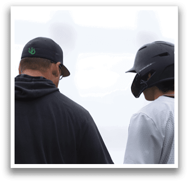 A man and a boy are standing next to each other. Description generated by AI