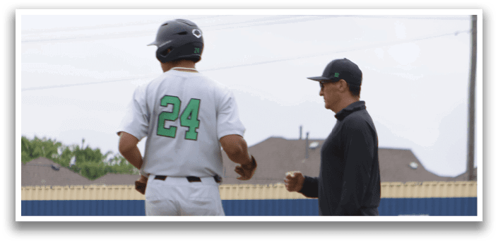 Two baseball players standing on a field. Description generated by AI