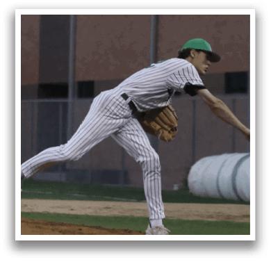 A baseball player in a white and green uniform is throwing a ball. Description generated by AI